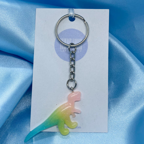 Pastel T-Rex dinosaur keychain with glittery specs